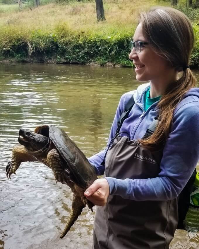 Ellie Campbell holding a Common Snapping Turtle